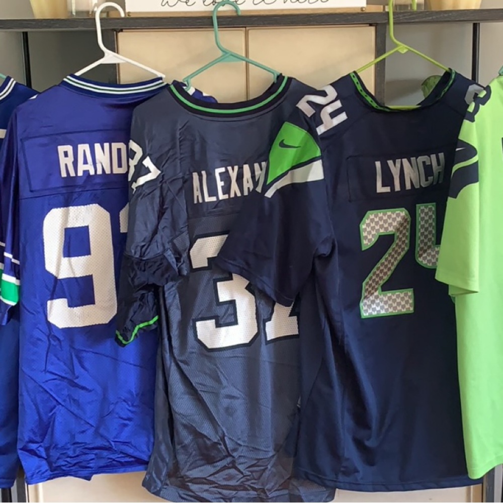 Several Seattle Seahawks jerseys from L to XL